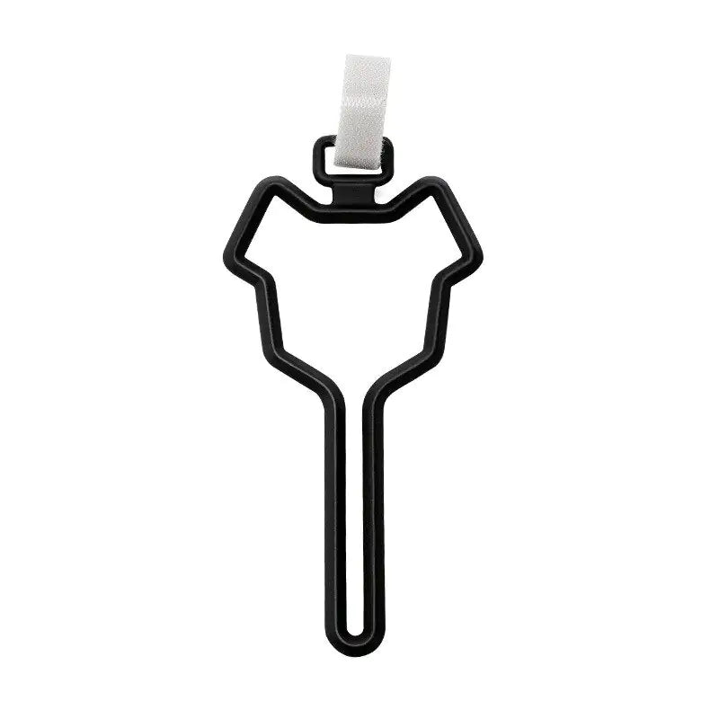 black pet waste bag clip with a secure white fastener, designed to easily attach to leashes, belts, or bags for convenient pet waste management.